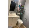 Simple bathroom with white vanity, toilet, and shower/tub combo at 2893 Franklin Rd, Lawrenceville, GA 30044