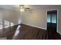 Spacious bedroom with dark hardwood floors and sliding glass doors at 3850 Bright Star Rd, Douglasville, GA 30135