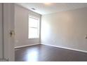 Spacious bedroom with hardwood floors and window at 1986 Patterson Park Pl, Lawrenceville, GA 30044