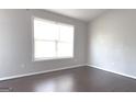Bright bedroom with hardwood floors and large window at 1986 Patterson Park Pl, Lawrenceville, GA 30044