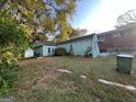 Light teal house with detached shed and yard at 1121 Montreat Sw Ave, Atlanta, GA 30310