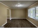 Spacious living room featuring hardwood floors and large windows at 2929 Stratford Mill Rd, Lithonia, GA 30038