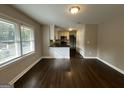 Modern kitchen with white cabinets, dark countertops, and stainless steel appliances at 3168 Mcafee Rd, Decatur, GA 30032
