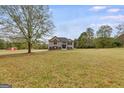 House with a large front yard and a detached barn at 1219 Harlan Lane Rd, Villa Rica, GA 30180