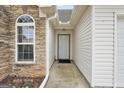 Front entry with stonework and a walkway at 1120 Strath Clyde Way, Mcdonough, GA 30253