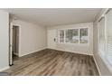 Living room with hardwood floors and large window at 1262 Lorenzo Sw Dr, Atlanta, GA 30310