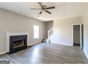 Simple living room with fireplace, laminate floors, and neutral colors at 2124 Hairston Creek Pkwy, Decatur, GA 30035