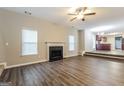 Living room with fireplace and laminate flooring at 7546 Petal Pl, Fairburn, GA 30213