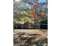 House exterior showcasing fall foliage and a covered patio at 5605 Bethlehem Rd, Fairburn, GA 30213