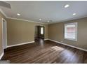 Spacious living room with dark wood floors and recessed lighting at 1764 Thomas Ter, Decatur, GA 30032