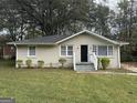 Updated Ranch home with landscaped lawn and front steps at 1764 Thomas Ter, Decatur, GA 30032