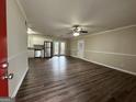 Open living room with laminate wood floors and access to the kitchen at 4433 Mercer Rd, Decatur, GA 30035