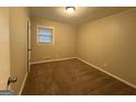 Simple bedroom with neutral walls and carpet at 3691 Fred Walker Sw Dr, Smyrna, GA 30082