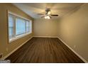 Living room with hardwood floors and large bay window at 3691 Fred Walker Sw Dr, Smyrna, GA 30082