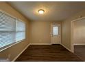 Simple dining area with hardwood floors and backyard access at 2997 Tara Woods Dr, Douglasville, GA 30135