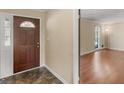 Front entry with wood door and view into living room at 434 Lees Lake Rd, Fayetteville, GA 30214