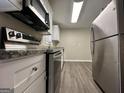Kitchen with stainless steel appliances and granite countertops at 5950 Community Se Rd, Mableton, GA 30126