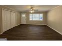 Spacious living room with hardwood floors and lots of natural light at 5950 Community Se Rd, Mableton, GA 30126