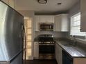 Renovated kitchen featuring stainless steel appliances and granite countertops at 2190 Westover Dr, East Point, GA 30344
