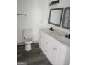 Double vanity bathroom with marble countertops at 1511 Mims Sw St, Atlanta, GA 30314