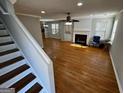 Bright living room with hardwood floors, fireplace, and access to the kitchen at 1004 Alford Ct, Lithonia, GA 30058