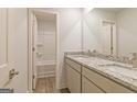 Double vanity bathroom with granite countertop and a shower at 145 Weldon St # 59, Mcdonough, GA 30253