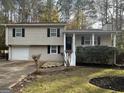 Charming ranch home features a spacious yard and attached garage at 3031 Tara Woods Dr, Douglasville, GA 30135