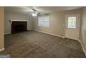 Bright living room with fireplace and neutral carpeting at 3031 Tara Woods Dr, Douglasville, GA 30135