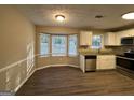 Eat in kitchen with bay window and granite countertops at 245 Remington Trl, Ellenwood, GA 30294