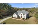 Two-story house with a large backyard and wooded area at 2202 Escalade Ct, Conyers, GA 30094