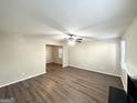 Spacious living room featuring hardwood floors and a ceiling fan at 6235 Creekford Ln, Lithonia, GA 30058