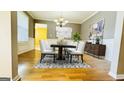 Bright dining room with hardwood floors and stylish furnishings at 90 Ashford Dr, Oxford, GA 30054