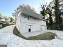 Gray two-story house with a long driveway at 2370 Tiffany Cir, Decatur, GA 30035