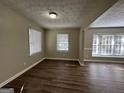 Bright dining area with hardwood floors and neutral walls at 2413 Ben Hill Rd, East Point, GA 30344