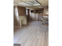 Unfinished basement with wood paneling and fireplace at 1521 Green Valley Ct, Conley, GA 30288