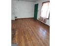 Bright living room featuring hardwood floors at 1521 Green Valley Ct, Conley, GA 30288