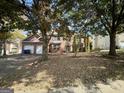 Two-story brick home with a large front yard at 1529 Evergreen Hollow Ln, Conyers, GA 30012