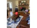 Living room with fireplace and hardwood floors at 8965 Campbellton St, Douglasville, GA 30134