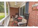 Relaxing screened porch with rocking chairs and ceiling fan at 611 Bernhard Rd, Fayetteville, GA 30215
