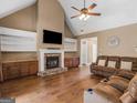 Large living room with stone fireplace and built-in shelving at 790 Eskew Rd, Mcdonough, GA 30252