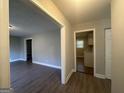 Bright hallway with hardwood floors, leading to kitchen and living areas at 2658 Rollingwood Se Ln, Atlanta, GA 30316