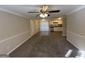 Bright living room with new carpet and view into kitchen at 4906 Springbrook Dr, Douglasville, GA 30135