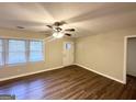 Spacious living area with hardwood floors and neutral walls at 1737 Mckenzie Dr, Decatur, GA 30032