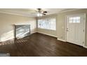 Bright living room with hardwood floors, fireplace and neutral walls at 8406 Norris Lake Rd, Snellville, GA 30039