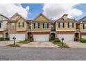 Townhouse with attached garage and landscaping at 53 Providence Oak Ct, Lawrenceville, GA 30046