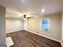 Spacious living room with hardwood floors and window at 1327 Sharon Nw St, Atlanta, GA 30314