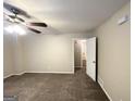 Spacious bedroom with neutral carpeting and ceiling fan at 220 Oakcliff Nw Ct, Atlanta, GA 30331