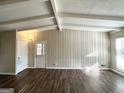 Spacious living area with wood-look floors and exposed beams at 3010 Pasadena Dr, Decatur, GA 30032