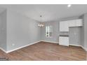 Dining area with hardwood floors and white cabinets at 5374 Tolar Rd # 79, South Fulton, GA 30213