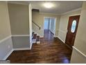 Hardwood floors, staircase, and an open concept at 4010 Wembley Forest Way, Atlanta, GA 30340